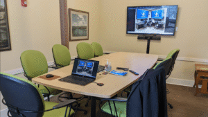 Conference room with tech for a display and multi-directional communication